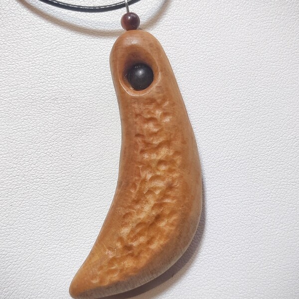 6 x 3 cm alder wood pendant with ebony insert and 4 mm red tiger eye bead