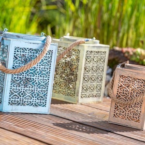 Pastel-colored wooden lantern with glass insert and jute rope handle, two sizes
