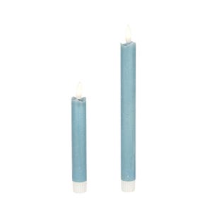 May include: Two blue taper candles with a white base and a flickering flame. The candles are different heights, with the taller one measuring approximately 10 inches and the shorter one about 6 inches. The background is plain white.