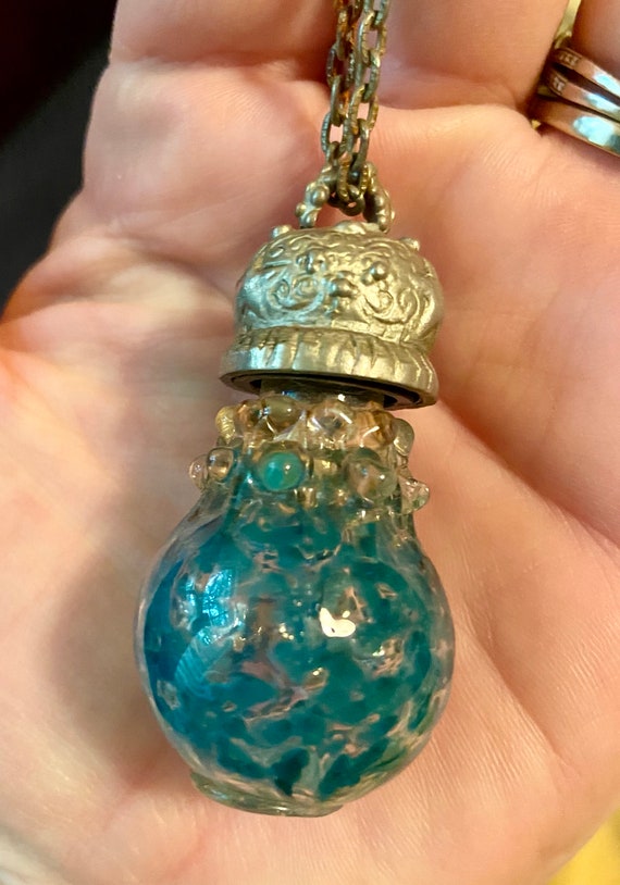 Blown glass hollow pendant with pewter top