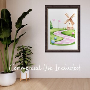 May include: Watercolor painting of a golf course scene with a windmill, pink and white checkered path, golf balls, and pink flags. The artwork is framed in a dark brown frame and hangs on a white wall. The words "Commercial Use Included" are written in cursive.