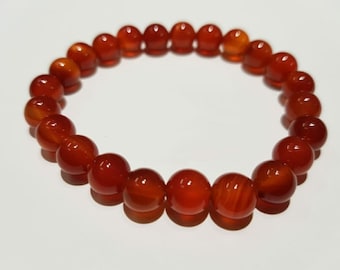 Pulsera de cornalina roja brillante, hecha a mano con cuentas de 7 mm. Pulsera de cornalina para mano derecha. Un regalo ideal.