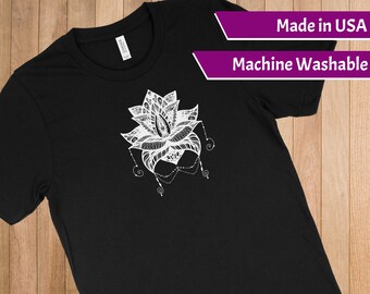 May include: Black t-shirt with a white graphic of a detailed lotus flower design. Made in USA. Machine Washable.