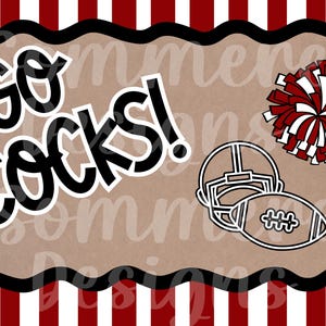 May include: A rectangular design with a brown background, black border, and red and white striped edges. The words "Go Cocks!" are in bold black and white lettering. A football helmet, football, and pom-pom are also featured.