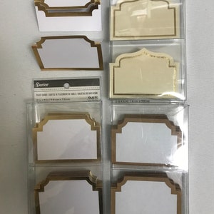 Tarjetas de lugar para bodas, despedidas de soltera, quinceañeras, aniversarios y eventos. Cinco estilos. Tarjetas de lugar en blanco fáciles de llenar. Paquetes de 24 y 50. Blanco, marfil, dorado y negro.