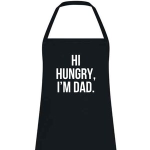 May include: Black apron with the text "HI HUNGRY, I'M DAD." in white block letters. The apron has a neck loop and waist ties. This kitchen accessory is perfect for cooking and grilling.