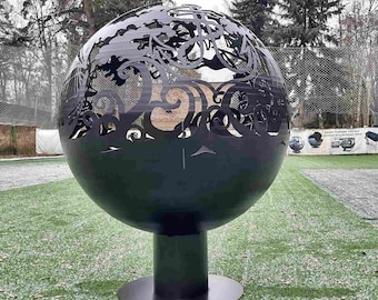 May include: A black metal fire pit shaped like a sphere with a decorative cut-out design. The fire pit is on a black metal stand.