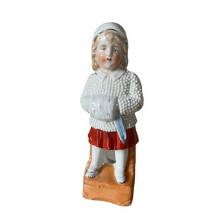 Girl with knitted coat (German figurine)