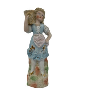 German figurine girl with basket