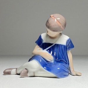 Bing & Grondahl Porcelain Figurine of Little Girl with a Doll, Bing and Grøndahl Little Girl with Toy Porcelain Figurine #1526