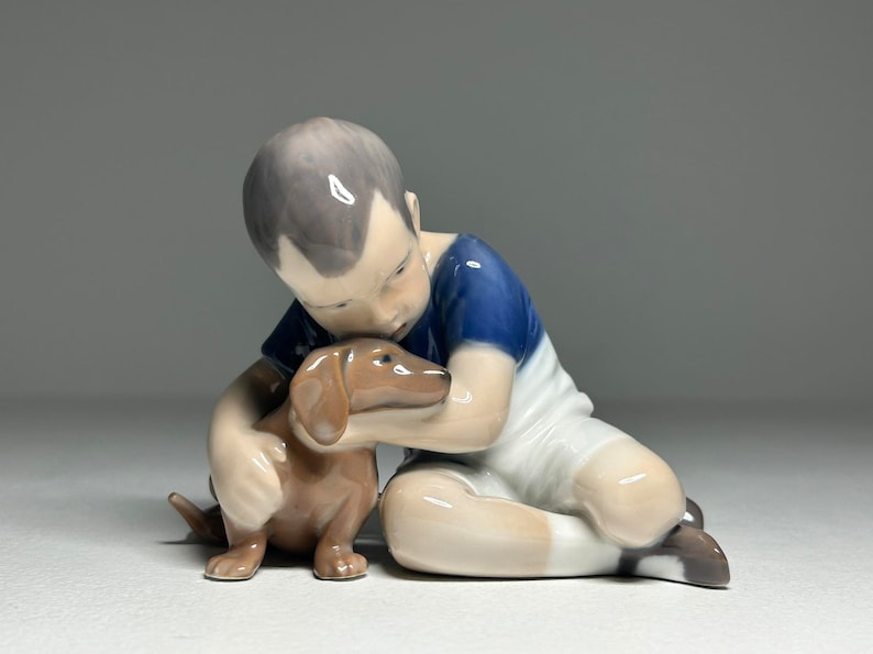 Royal Copenhagen Porcelain Figurine 'True Friendship' #1951, Royal Copenhagen Boy with Dog Figurine by Ingeborg Plockross Irminger image 1