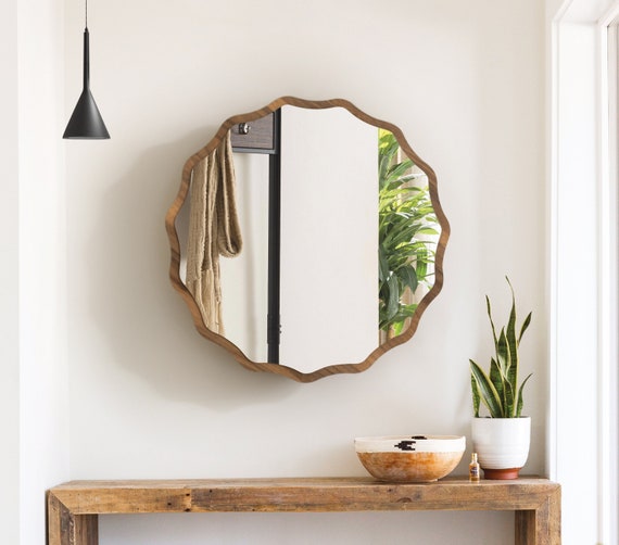 Black-and-white-entryway-with-large-round-custom-cut-mirror-design