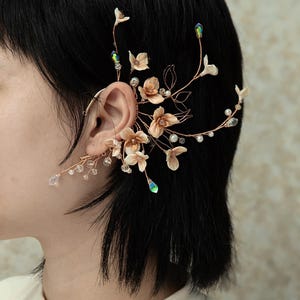 May include: A set of three ceramic mugs with a speckled, matte finish. The mugs are in shades of cream, light gray, and dark gray. Each mug has a simple, minimalist design, perfect for coffee or tea.