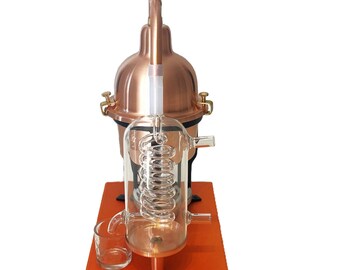 Alembic Distiller for essential oils & hydrosol in copper with glass condensation coil.