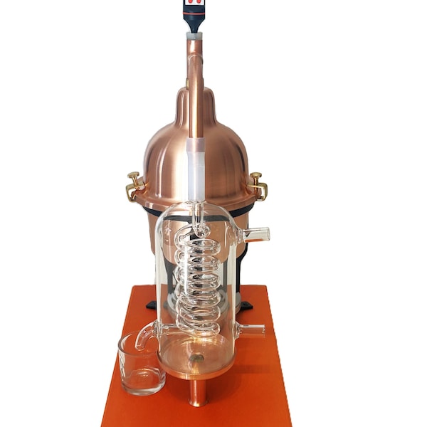 Alembic Distiller for essential oils & hydrolate in copper with glass condensation coil.