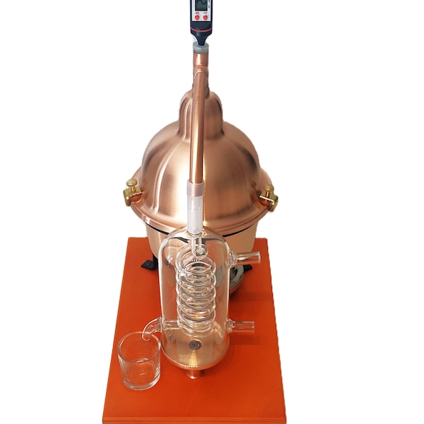 distillateur d'huiles essentielles en cuivre avec serpentin de condensation en verre. capacité 1 litre