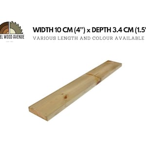 Puede incluir: Una tabla de madera que mide 10 cm de ancho y 3,4 cm de profundidad. La tabla es de color marrón claro y tiene una superficie lisa. El texto "WIDTH 10 CM (4") x DEPTH 3.4 CM (1.5")" y "STEEL WOOD AVENUE" es visible en la imagen.