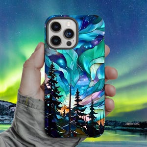 May include: A smartphone case featuring a stained-glass design of a forest scene under a vibrant aurora borealis. The case has a teal, blue, and purple color scheme with a detailed depiction of trees and the night sky.