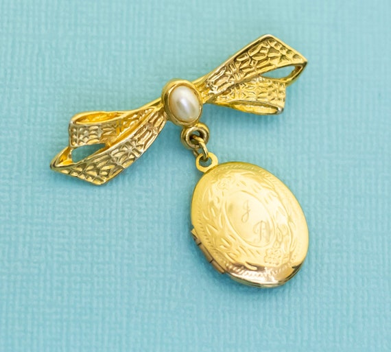 Vintage Gold Tone Ribbon Locket Oval Victorian Br… - image 1