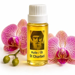 May include: A clear glass bottle filled with yellow liquid, featuring a label with an image of a man and the text "Huile / Öl St Charbel." The bottle is set against a backdrop of vibrant pink and purple orchid flowers.