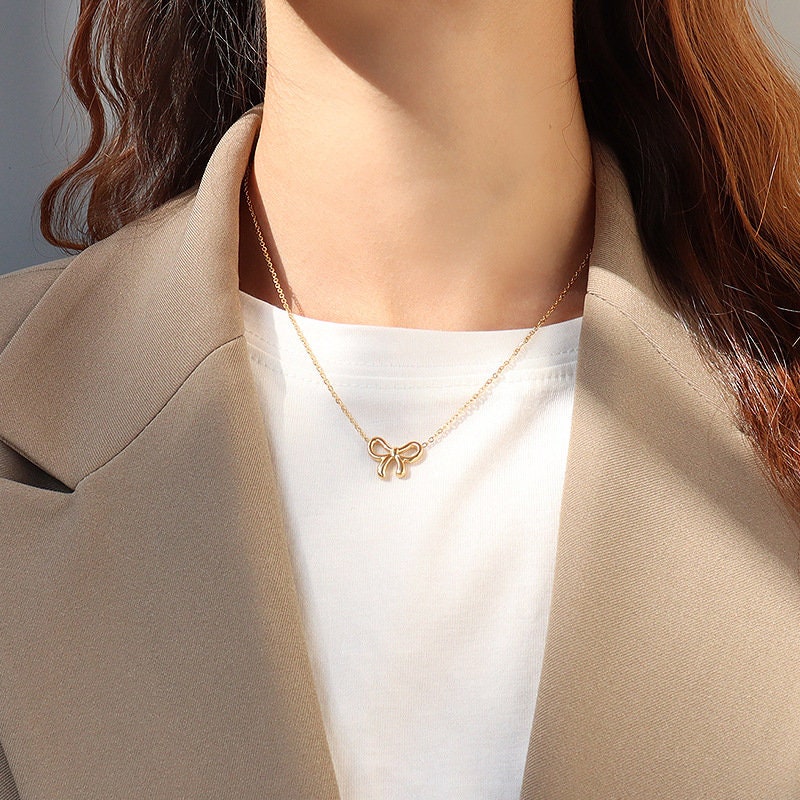 Collana con ciondolo a fiocco placcato oro 18 carati: catena