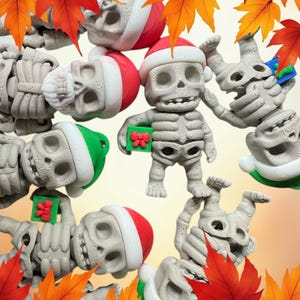 May include: A group of skeletal figures wearing Santa hats and holding gifts. The figures are made of a white material with a textured surface. The figures are surrounded by autumn leaves.