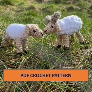 May include: Two crocheted white sheep with brown faces and legs, standing in a field of green grass. The text "PDF CROCHET PATTERN" is displayed on a banner below the sheep.