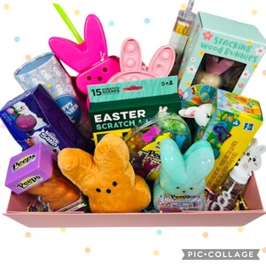 May include: A pink rectangular tray filled with Easter-themed toys and treats. Includes Peeps, a scratch art kit, a stacking wood bunnies game, and a variety of other colorful items. A fun gift basket for the holiday.