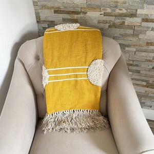 Mustard yellow throw top blanket and pillows
