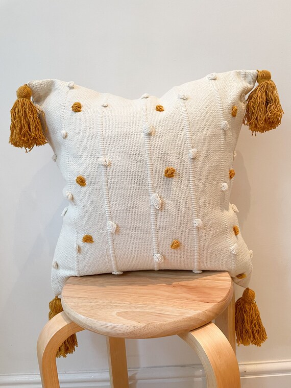 Orange and hot sale cream throw pillows