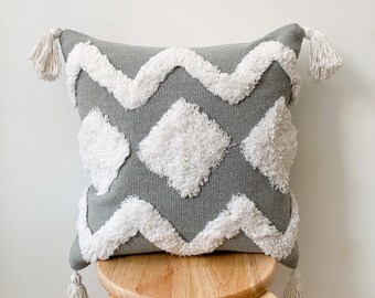 grey white cushions