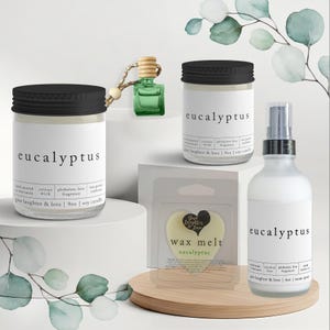 May include: A collection of eucalyptus-scented products, including candles, a room spray, a wax melt, and a car air freshener. The products are in clear glass jars and bottles with black lids and white labels. The text "eucalyptus" is prominently displayed.