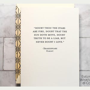 May include: A cream-colored card with a quote from Shakespeare's Hamlet: "Doubt thou the stars are fire...never doubt I love." The card has a decorative spine with a geometric pattern and the Evelyn Whatley & Co. logo.