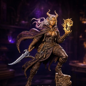May include: A detailed fantasy figurine of a horned character with long hair, wearing a dark brown leather outfit and a purple cape. The figure holds a glowing golden magical orb in one hand and a silver curved dagger in the other, standing on a stone base.