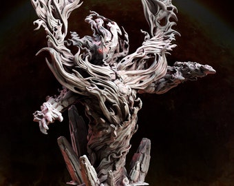 May include: A detailed, gray, sculpted figure of a creature with a humanoid torso and long, flowing, tendrils of hair or wings. The creature is standing on a base of rough, gray rocks.