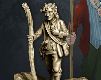 May include: A detailed miniature figurine of a person with long brown hair, wearing a brown tunic and holding a wooden staff. The figurine is standing on a round base with a textured surface.