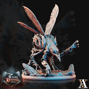 May include: A detailed miniature of a demonic creature with wings, a beak, and multiple legs. The creature is painted in shades of blue and gray, with intricate details on its wings. The miniature is posed on a circular base with a rocky texture.