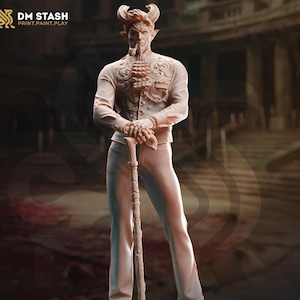 May include: A detailed miniature figurine of a devilish figure with horns, a goatee, and a monocle. The figure is wearing a white suit with a patterned waistcoat and holding a walking stick.