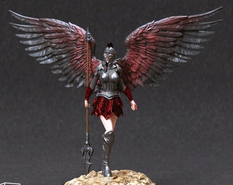 May include: A miniature figurine of a female warrior with wings, wearing armor and a red skirt, holding a spear. The figurine is painted in shades of gray, red, and black. The text "GEIRAVOR" is visible above the figurine.