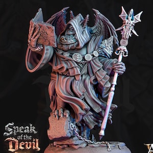 May include: A detailed miniature figurine of a demon with wings, wearing a hooded robe and holding a book and a staff. The figurine is standing on a stone base with chains. The text "Speak of the Devil Act II" is visible at the bottom of the image.