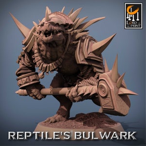 May include: A detailed miniature figurine of a reptilian creature wearing armor and wielding a spiked hammer. The figure is painted in shades of brown and grey, with a textured surface. The base of the figure is a circular platform with a rough, sandy texture. The text "REPTILE'S BULWARK" is printed below the figure.