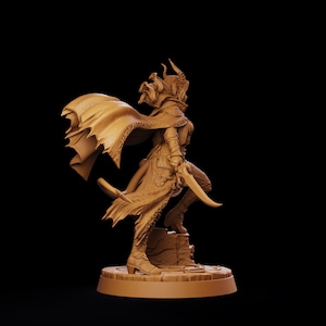 May include: A monochromatic tan miniature figurine of a horned character in a dynamic pose. The figure wears a flowing cape, layered armor, and boots, while holding a curved blade. It stands on a circular, textured base with a rocky element.