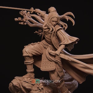 May include: A detailed sculpture of a warrior in a dynamic pose, wielding a katana. The figure is clad in traditional armor and clothing, with flowing hair and a determined expression. The sculpture is a neutral beige color and is set against a dark background.