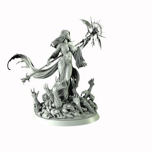 May include: A gray, detailed miniature figurine of a woman with long hair, wearing a flowing robe and holding a staff with a skull at the top. The figure is standing on a base with skeletal hands reaching up.