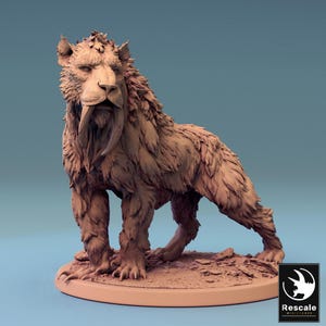 May include: A detailed, brown figurine of a saber-toothed tiger. The model has long, curved fangs and a shaggy mane. It stands on a small, textured base, with a logo in the bottom right corner.