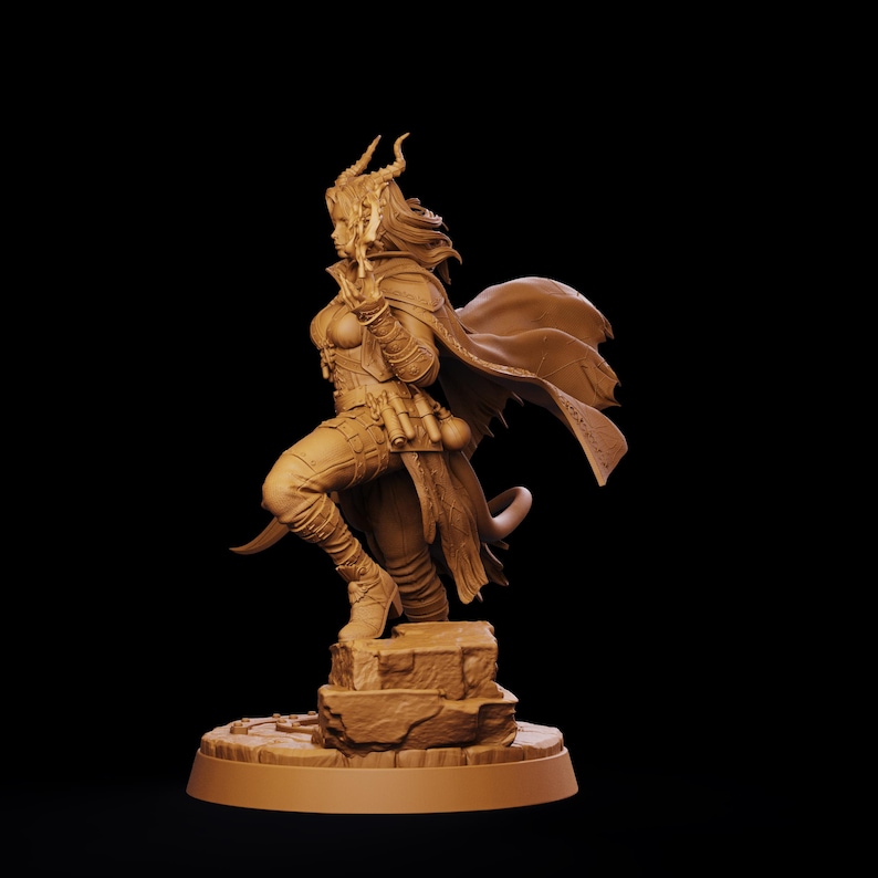 May include: A monochromatic tan miniature figurine of a horned character in a dynamic pose. The figure wears a long flowing cape, fitted armor, and boots, standing on a textured stone base. The character has long hair and a tail.