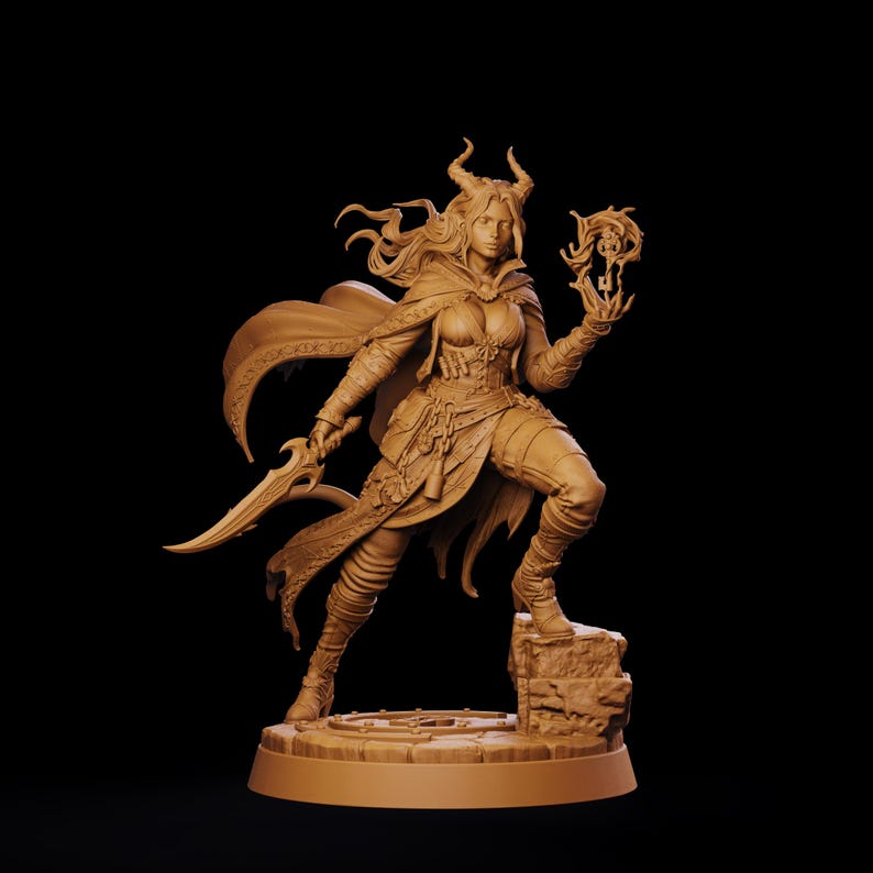 May include: A monochromatic tan figurine of a horned female warrior standing on a stone base. The figure wears a cloak, armor, and boots, holding a curved blade in one hand and a glowing magical key-like object in the other, with flowing hair.
