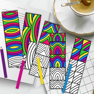 May include: Five colorful bookmarks with geometric patterns. The bookmarks are black and white line drawings with colorful geometric shapes filled in. The bookmarks are on a white surface with a book, pencils, and a cup of tea.