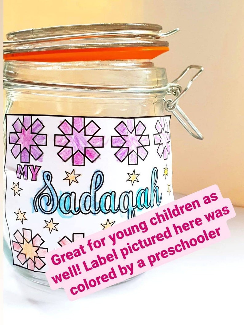 May include: A clear glass jar with a metal latch and a white label. The label has a colorful design with stars and the word "MY Sadagah". The label also includes the text "Great for young children as well! Label pictured here was colored by a preschooler."