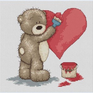 May include: A brown teddy bear painting a red heart with a blue paintbrush. A red paint can is on the ground with red paint splattered around it.